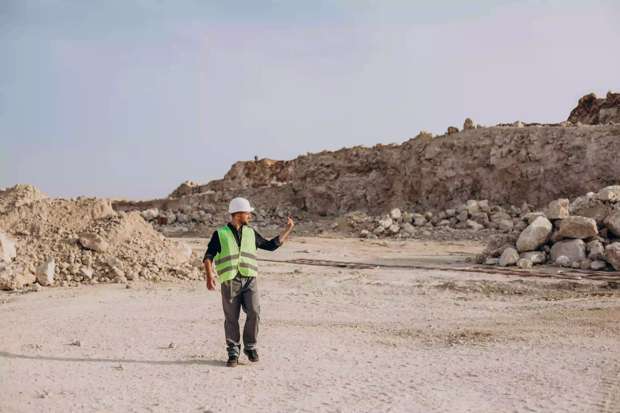 worker-hardhat-standing-sand-quarry