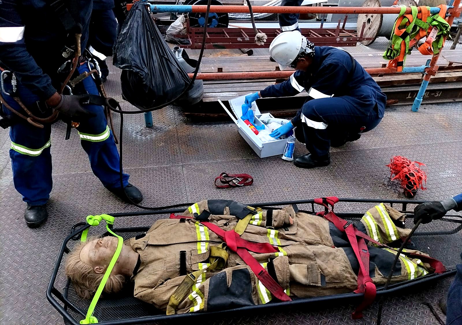 Emergency rescue training exercise with a stretcher and rescue kit